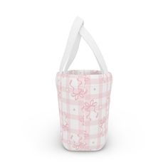 a pink and white checkered basket with handles