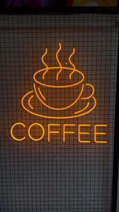 a neon sign that says coffee on it