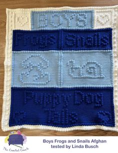 a blue and white crocheted afghan with the words boys frogs and snails written on it