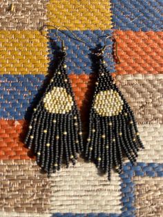 Moon & Stars  boho seed bead earrings are handmade , stunning black , white, and cream design. Made with beautiful Miami seed beads. Handmade by Me! Cream Design, Beads Handmade, Moon Stars, Seed Bead Earrings, Bead Earrings, White Design, Stars And Moon, Seed Bead, Black Background