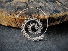 These unique bohemian spiral silver earrings dangle will be a must-have in your wardrobe. Large earring design, silver painted stainless steel material, hypoallergenic Length: 1.5 inches Width: 1.5 inch Unique handmade earrings, you can wear it on any occasion: Dating, Party, Beach, Christmas,... It is also a meaningful gift for friends, colleagues, family... Processing time:  3-4 business days Shipping time: - USA: 4-6 business days On average, about 8-10 business days you will receive your order !! Each item is handmade, so its appearance may vary slightly from the product images. Colors may differ slightly due to computer monitor screen settings. !! For the best jewelry preservation, avoid wearing them while bathing, swimming, or exercising hard. Love them as your friend !! Click here t Silver Hippie Dangle Jewelry, Unique Spiral Jewelry For Festivals, Hippie Silver Dangle Jewelry, Bohemian Spiral Adjustable Earrings, Adjustable Spiral Bohemian Earrings, Handmade Bohemian Swirl Earrings, Silver Hippie Jewelry Suitable For Beach, Hippie Silver Jewelry For The Beach, Spiral Earrings For Festivals