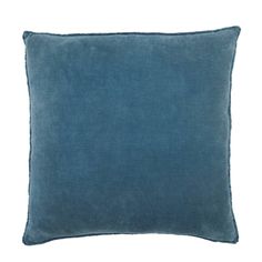 a blue pillow on a white background