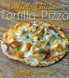 a homemade buffalo chicken tortilla pizza on a wooden table with text overlay that reads buffalo chicken tortilla pizza