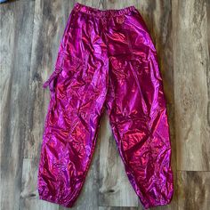 Brand New With Tags! These Hot Pink Parachutes Pants Will Definitely Make A Statement! They Would Be Perfect For Concerts, Halloween Or Going Out! They Have Elastic Around The Bottoms Of The Leg And An Adjustable Waist. Cargo Pocket On The Side And Traditional Pockets Too! Trendy Fitted Pink Parachute Pants, Trendy Party Cargo Pants With Pockets, Trendy Cargo Pants With Pockets For Party, Trendy Cargo Pants For Party, Pink Festival Pants With Elastic Waistband, Pink Elastic Waistband Pants For Festival, Pink Pants With Elastic Waistband For Festival, High Waist Rave Bottoms For Spring, Purple Rave Festival Bottoms