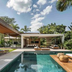 an outdoor swimming pool with lounge chairs and palm trees in the backgrouds