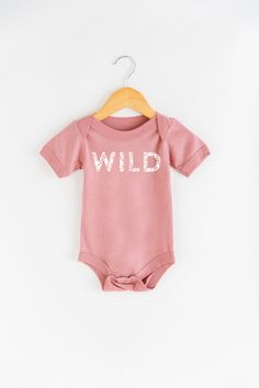 All good things are WILD and free - Including your little one when they're crawling around in the most adorable onesie! Product Info See size chart in product images for more details. Measurements can vary up to 1 inch depending on color, material, etc. Cream and Mustard: 100% Cotton Mauve and Heather Olive: 25% soft airlume cotton, 25% rayon, 50% polyester Apparel Care Instructions Wash in cold water with a natural detergent. Air dry or turn inside out and dry on low. Shipping Info Orders ship Slow Flower, Natural Detergent, Flower Farmer, Autumn Sales, Fall Kids, Adulting Shirts, Pesticides, Kid Tees, Product Images