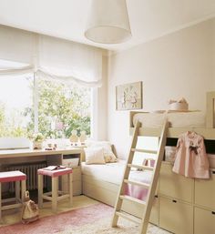 a child's bedroom with bunk beds and desks