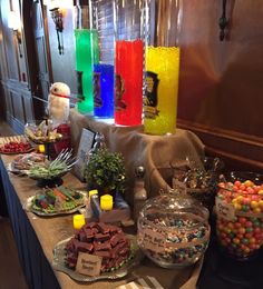 a buffet table with candy, candies and other items on it at a holiday party