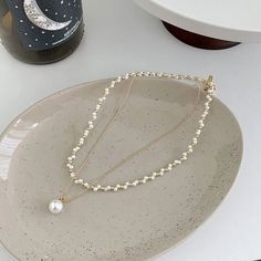 ✦ Make a statement with our Elegant Layered Pearl Necklace. This stunning necklace showcases multiple layers of luminous pearls, creating a chic and fashionable layered effect. The intricate design and the elegant pendant enhance the beauty of the pearls, adding a touch of glamour to your ensemble. Whether dressed up or down, this layered pearl necklace is a perfect accessory to elevate your style and capture attention wherever you go. ----------- DETAILS ------------ SKU: HN8552- Materials: All Pearl Necklace Layering, Necklace With Pearl, Layered Pearl Necklace, Basic Jewelry, Nose Rings Hoop, Crystal Hoop Earrings, Elegant Pendant, Fashion Jewelry Earrings, Faux Pearl Necklace