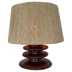 a table lamp with a brown shade on it