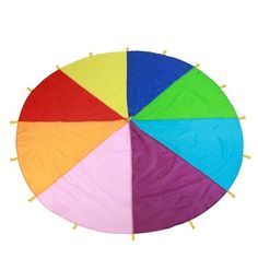 a multicolored umbrella sitting on top of a white surface