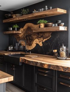 a kitchen with black cabinets and wooden shelves