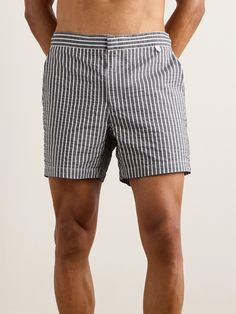 DESIGNED BY MR PORTER. Mr P.'s swim shorts are made from lightweight seersucker in a grey and white striped pattern. They're cut for a straight-leg fit and have a zipped fly and an internal drawstring waistband. Striped Short Beachwear Swim Trunks, Seersucker Bottoms For Beach, Short Length, Short Seersucker Bottoms For Vacation, Seersucker Short Bottoms For Vacation, Seersucker Shorts For Summer Beach, Seersucker Shorts For Beach In Summer, Summer Beach Seersucker Bottoms, Summer Beach Seersucker Shorts, Relaxed Fit Seersucker Bottoms For Summer