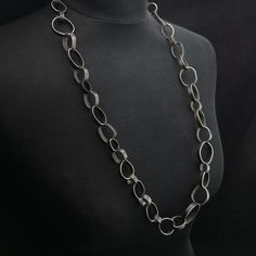 This was an exercise on repetition, volume and forming just using my hands.It measures 24" and comes without a clasp.It is made from alpaca or "nickel" silver, once it has been oxidized for contrast, brushed in light streaks and waxed the result is a matte dark surface which will not change color with wear.This is quite the statement piece and needs little else if you are one to wear strong pieces of jewelry this one is for you.Ready to ship and packed in a ready for gift giving in a eco-friendl Modern Handmade Link Chain Necklace, Modern Handmade Metal Chain Necklace, Light Streaks, Handmade Chain, An Exercise, Wide Band Rings, Wedding Jewellery Necklace, Nickel Silver, Delicate Jewelry