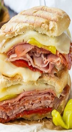 a close up of a sandwich with meat and cheese