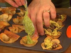 a person is cutting up some food on a tray