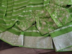 Blouse stitched - Yes Blouse Opening - Back Sleeves Length - Elbow Padded - No Blouse size - 34 with inner margins expandable upto 42 For Blouse Size 32 alteration can be done on request. Fall/pico - Yes done Fitted Pista Green Blouse Piece With Cutdana, Fitted Pista Green Chanderi Blouse, Fitted Green Blouse With Zari Weaving, Pista Green Blouse Piece For Transitional Season, Traditional Drape Blouse With Border, Traditional Fitted Blouse Piece In Pista Green, Fitted Festive Blouse With Border, Fitted Silk Blouse In Pista Green, Fitted Wedding Blouse With Border