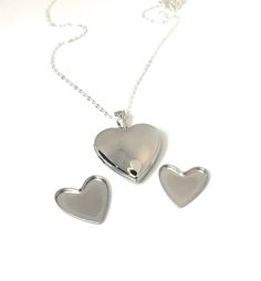 Made from SOLID Sterling Silver, this heart locket pendant opens like a normal locket. You can insert a photo on one side and the other side contains a heart compartment that clicks together which you can store your loved ones ashes or your pets, keeping them close to your heart always. You could also store sand from a beach or anything sentimental from a special place or a special someone.   ♥︎ Brand new and never been worn. Multiple available. ♥︎ Please feel free to message me with any questio Nickel-free Heart Locket Necklace For Anniversary, Heart Charm Memorial Locket Necklace, Heart-shaped Locket Necklace With Heart Charm For Memorials, Heart Shaped Locket Necklace With Heart Charm For Memorial, Heart Shaped Locket Necklace For Memorial, Memorial Heart Charm Locket Necklace, Nickel-free Heart Locket Necklace For Memorial, Heart-shaped Nickel-free Locket Necklace For Memorial, Memorial Heart-shaped Nickel-free Locket Necklace