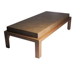 a coffee table made out of wood and leather on an isolated white background with no one around it