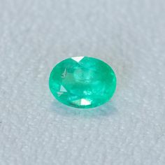 This loose stone is available for a custom ring by Anueva Jewelry. Select your stone first and then select a setting. Add both to your cart and we'll create your ring! 1.29CT OVAL BRILLIANT ZAMBIAN EMERALD, NEON GREEN, 8X6MM. We selected these emeralds for their vibrant, almost neon colors! Natural internal silk, common for emeralds. But still has great flash of sparkle! About Heat Treatments: Some colored gemstones are routinely heated for color and clarity improvement. This is a permanent trea Gia Certified Oval Emerald Gemstone, Gia Certified Oval Emerald, Oval Emerald Gemstone For May Birthstone, Oval Emerald Gemstones For Wedding, Gia Certified Oval Green Gemstones, Oval Emerald Wedding Gemstones, Classic Emerald Cut Birthstone Gemstones, Oval Emerald Gemstones With Prong Setting, Oval Untreated Green Emerald Ring