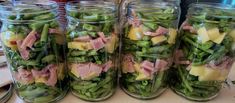 several jars filled with different types of food