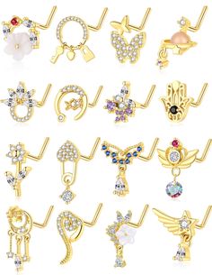 many different types of brooches are shown in this image, including one with an angel