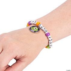 a person wearing a bracelet with words on it