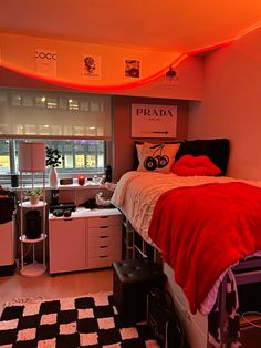 a bed room with a neatly made bed and a checkered rug on the floor