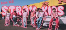 a group of young people standing in front of a car with the word stencixs painted on it