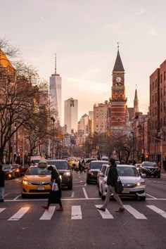 people crossing the street at an intersection in new york city