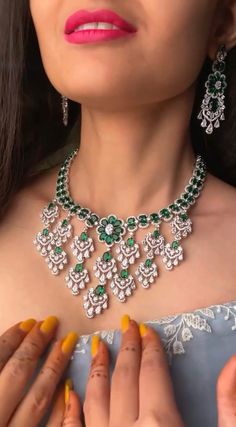 Add a touch of glamour and sophistication with this high quality necklace set in beautiful emerald gree. stones. The stones in this set bling and look close to the real thing. This set is sure to make heads turn!  It features an adjustable necklace and a pair of earrings. It can be paired perfectly with both ethnic and western outfits.  In case of any queries, please feel free to reach out. Happy shopping! Indian Ring Ceremony, Emerald Necklace Set, Diamond Emerald Necklace, Green Necklace Set, Necklace Set Indian Bridal Jewelry, Emerald Green Necklace, Necklace Closure, Haute Jewelry, Indian Rings