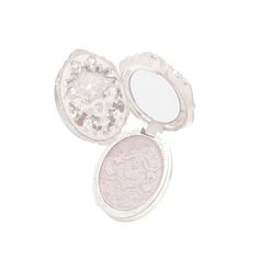 two compact mirrors sitting next to each other on top of a white surface with the lid open