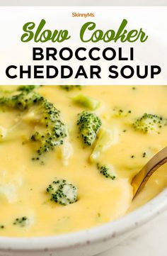 broccoli cheddar soup in a white bowl with a spoon