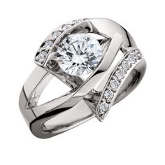 a white gold engagement ring with diamonds on the sides and an intricate design in the center