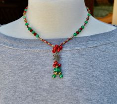 Handmade artisan Christmas beaded necklace gift for her.  This beautiful beaded Christmas necklace is loaded with different antique brass beads, a beautiful antique brass snowflake for the focal point, red and green metallic 11/0 miyuki seed beads, green and red czech glass beads in different shapes.  Made on very strong beading wire.  Has a lobster clasp.  If you need an extender chain just message me.  I usually ship in a brown jewelry box so if you want a Christmas box just let me know.  Everything is nickel free.  This statement necklace makes great Christmas gifts for her. To visit my Etsy store click here: https://www.etsy.com/shop/BNJewelryAndArtwork Here Are A Few Details about my handmade jewelry: * I use very strong bead stringing wire for my necklaces * No two are alike * I use Handmade Adjustable Necklaces For Holidays, Bohemian Christmas Jewelry With Beads, Handmade Vintage Jewelry For Holidays, Bohemian Jewelry For Christmas Holiday, Bohemian Jewelry For Christmas, Bohemian Christmas Jewelry, Bohemian Christmas Holiday Jewelry, Vintage Handmade Holiday Jewelry, Handmade Christmas Necklaces For Festive Occasions