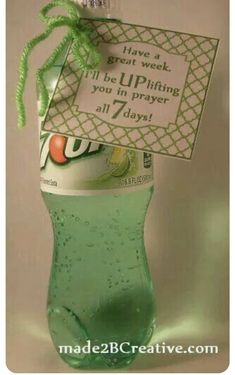 a green bottle with a tag attached to it that says, have a great week i'll upiting you in prayer all 7 days