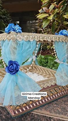 a blue flowered basket sitting on top of a table