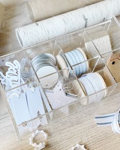 an organized drawer with plates and napkins