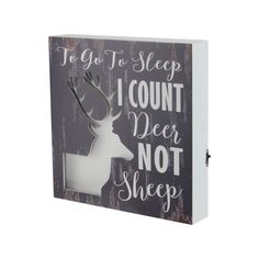 a wooden sign that says to go to sleep i count deer not sheep