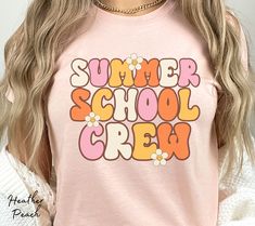 "Summer school teachers, show your enthusiasm for summer school with this cute retro aesthetic \"Summer School Crew\" shirt. Our crewneck t-shirt features daisies and retro lettering in pink, orange, cream, and yellow colors. These make great matching teacher shirts and are sure to be a hit with your fellow teachers and students. See more of our Teacher Shirts at: https://www.etsy.com/shop/DesiLuAndCo?ref=seller-platform-mcnav§ion_id=40932518 Visit our shop for more great items at: https://www.etsy.com/shop/DesiLuAndCo?ref=seller-platform-mcnav Welcome to our shop! Your satisfaction is our main goal and we are glad to answer any questions you might have about our products. Please contact us if you have any questions or customization queries. If you like the design but prefer a different sh Summer School Spirit Tops, Short Sleeve T-shirt For School In Summer, Summer College Slogan T-shirt, Retro Summer School Tops, Cute Spring College Tops, Pink Summer School Tops, Cute Tops For College In Spring, Retro Summer Tops For College, Summer School Slogan Tops