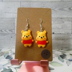 Winnie The Pooh Fish Hook Earrings. Colors Are Yellow, Red, Pink, Black, And Brown. Measurements Length: 1.20" Width: .75" Winnie The Pooh Earrings, Quirky Handmade Yellow Earrings, Quirky Yellow Jewelry Gift, Quirky Yellow Jewelry For Gift, Ellie Aesthetic, Clay Idea, Clay Pins, Large Silver Hoop Earrings, Clay Magnets