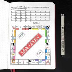 a game board and pen sitting on top of a notebook with the words save doy