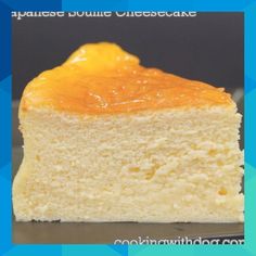 a piece of cake with orange icing on it sitting on a plate next to a fork