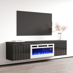 an entertainment center with a television mounted on the wall