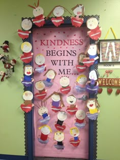 a classroom door decorated with cupcakes and magnets that say kindness begins with me