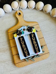 Beautiful handmade black and gold Purdue cork leather earrings. Perfect for Purdue game days! Be sure to check out all of my other listings for Purdue earrings! Fun statement earrings for every Purdue fan! Boiler Up! FREE SHIPPING on all orders $35+, discount automatically applied at checkout! LOCALS: If you would like to pick your order up from my home in Oxford, Indiana - please use code "LOCALPICKUP" to eliminate the shipping charge. OR - SHOP PURDUE EARRINGS IN PERSON at The Emporium in West Lafayette (445 Sagamore)! West Lafayette, Leather Bar, Order Up, Bar Earrings, Leather Earrings, Black And Gold, My Home, Statement Earrings, Indiana