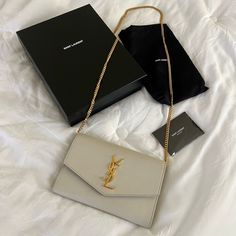 *Does Not Come With The Card Holder* I’m The Original Owner Of This Bag, I Purchased It From The Ysl Store In Honolulu On July 2, 2021. This Bag Is In Great Condition! There Are Very Minor Scuffs On The Inside Near The Chain Hooks, Please See Photos. I’ve Taken Great Care Of Her And Still Have The Authenticity Cards, Dust Bag, Original Box, And Proof Of Purchase With My Name On It (E-Receipt). Feel Free To Leave A Comment With Any Questions If You Are Interested. Ysl Uptown Wallet On Chain, Ysl Store, Bags Ysl, Yves Saint Laurent Bags, Wallet On Chain, Cream And Gold, Honolulu, My Name, Gold Hardware