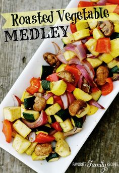 roasted vegetable medley on a white platter with text overlay that reads roasted vegetable medley