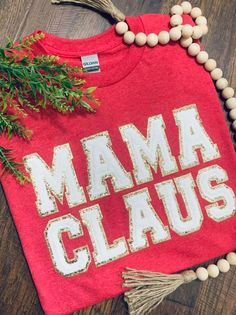 Women's MaMa Claus embroidered varsity letter shirt. GILDAN Heavy Cotton SHORT SLEEVE shirt is used to complete this design.  Care: Wash Cold, inside out. Lay flat to dry. Steam to remove wrinkles. Processing time is 7-14 days, not including weekends!! Christmas Cotton Top With Embroidered Text, Holiday Embroidered Cotton Top, Varsity Letters, Letter Shirt, Varsity Letter, Womens Christmas Shirts, Womens Christmas, Mrs Claus, Shirt Embroidery