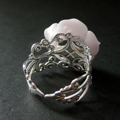 "The palest shade of purple resin has been used to create a resin rose that has then been set upon a filigree adjustable ring base in your choice of finish in this delicate handmade rose ring that is made to be adjustable from size 6 and up. Flower Size: 19mm To see this ring in all available colors, check here: http://etsy.me/1gr9dLc The base for this handmade ring is adjustable, which makes this delicate rose ring comfortable no matter the size of the wearer's fingers (size 6 and up) as well a Adjustable Pink Resin Rings, Handmade Elegant Resin Rings, Elegant Handmade Resin Rings, Nickel-free Pink Rings For Weddings, Elegant Nickel-free Pink Ring, Purple Resin, Resin Rose, Ring Purple, Handmade Rose